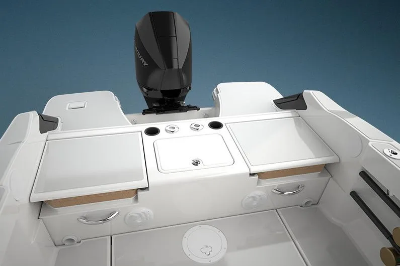 Slide: The Image of 2023 Bayliner Trophy 20CC boat interior with motor, featuring sleek design and storage compartments. - 36