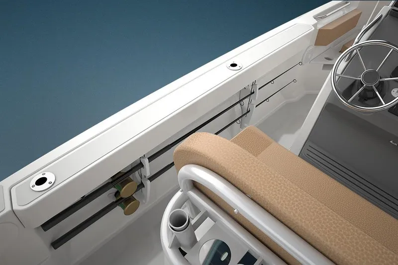 Slide: The Image of 2023 Bayliner Trophy 20CC boat interior with steering wheel and rod holders. - 38
