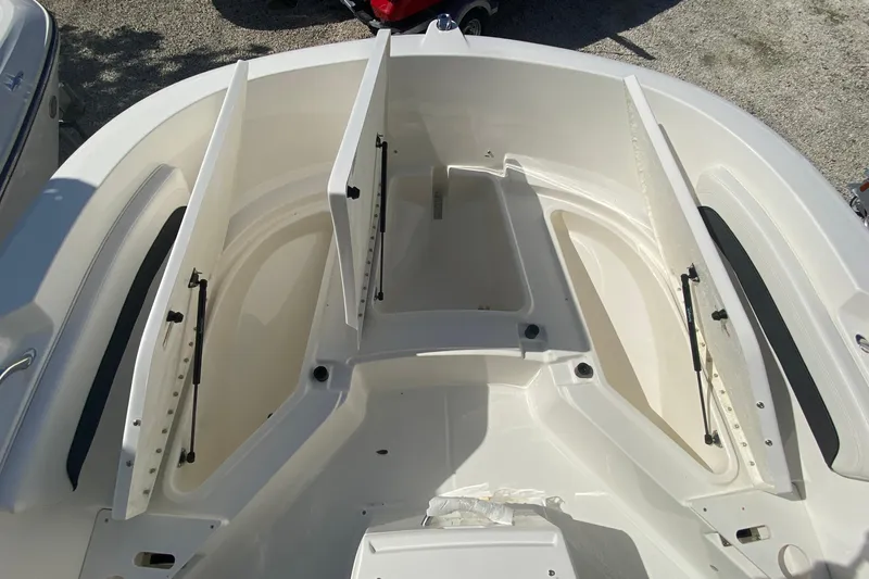 Slide: The Image of 2023 Bayliner Trophy T20CC boat storage compartments, open and spacious, viewed from above. - 7
