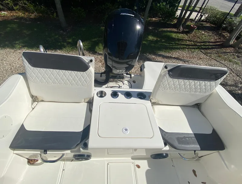 Slide: The Image of 2023 Bayliner Trophy 20CC boat with two people fishing at sunset. - 7