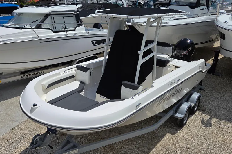 Slide: The Image of 2023 Bayliner Trophy T20CC boat on trailer, featuring sleek design and modern amenities. - 4