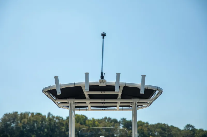 Slide: The Image of 2024 Bayliner Trophy 20CX boat top with antenna against clear sky. - 13