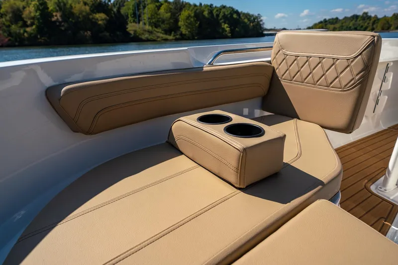 Slide: The Image of 2024 Bayliner Trophy 20CX boat interior with tan seating and cup holders. - 19