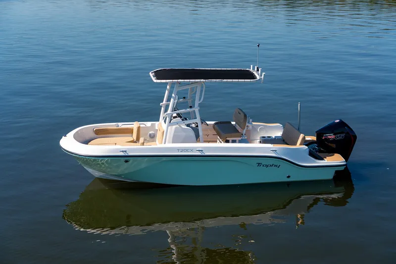 Slide: The Image of 2024 Bayliner Trophy 20CX boat on calm water, featuring sleek design and modern amenities. - 21