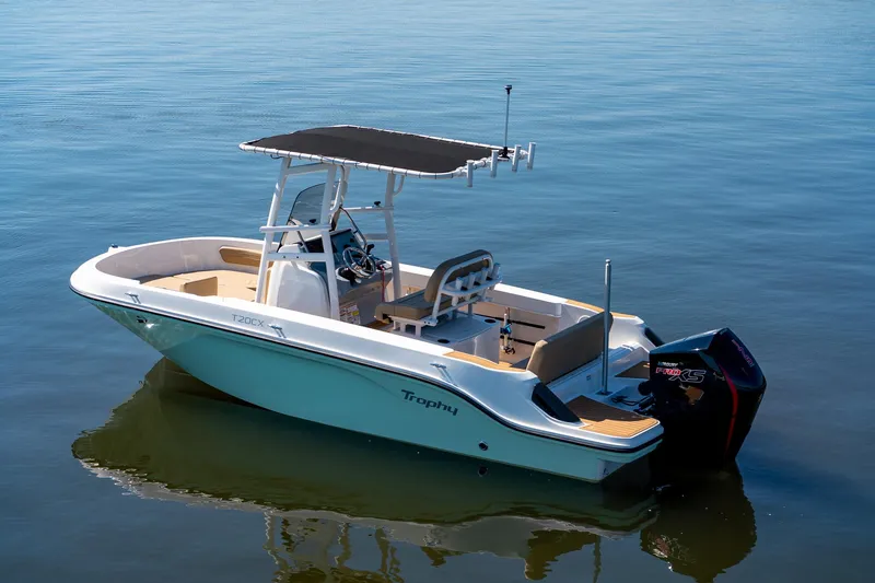 Slide: The Image of 2024 Bayliner Trophy 20CX boat on calm water, featuring a sleek design and modern amenities. - 22