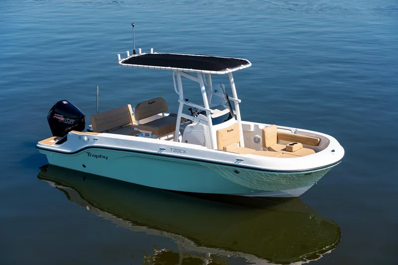 Slide: The Image of 2024 Bayliner Trophy 20CX boat on calm water, featuring sleek design and modern amenities. - 24
