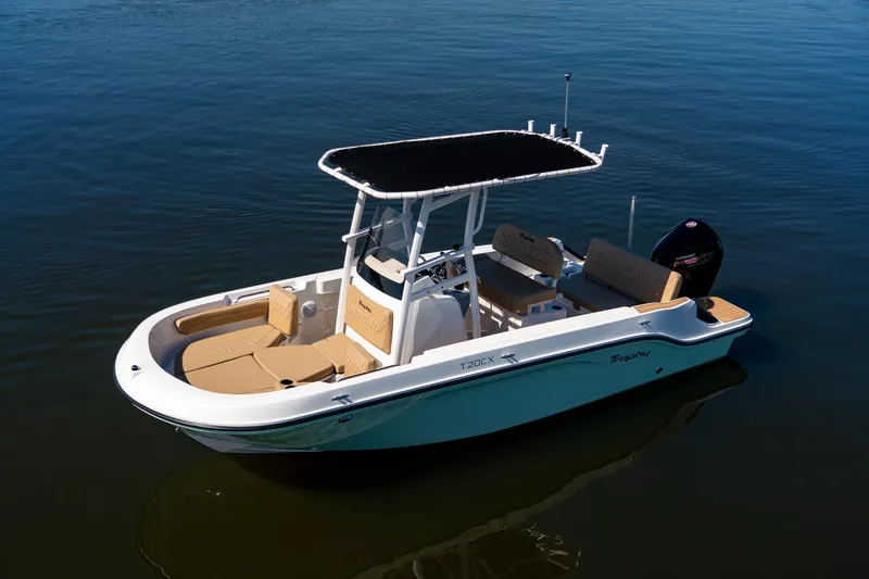 Slide: The Image of 2024 Bayliner Trophy 20CX boat on calm water, featuring a sleek design and spacious deck. - 25