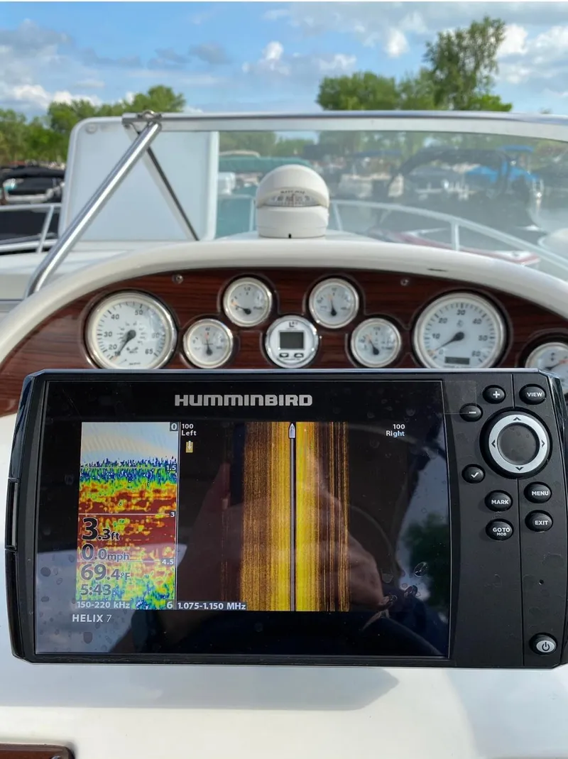 Slide: The Image of Boat dashboard with Humminbird sonar display on a 2001 Larson 254 Cabrio. - 2