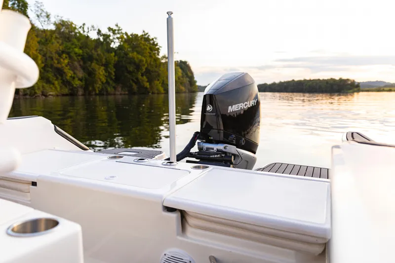 Slide: The Image of 2024 Bayliner Trophy 22CC boat with Mercury engine on calm water. - 7