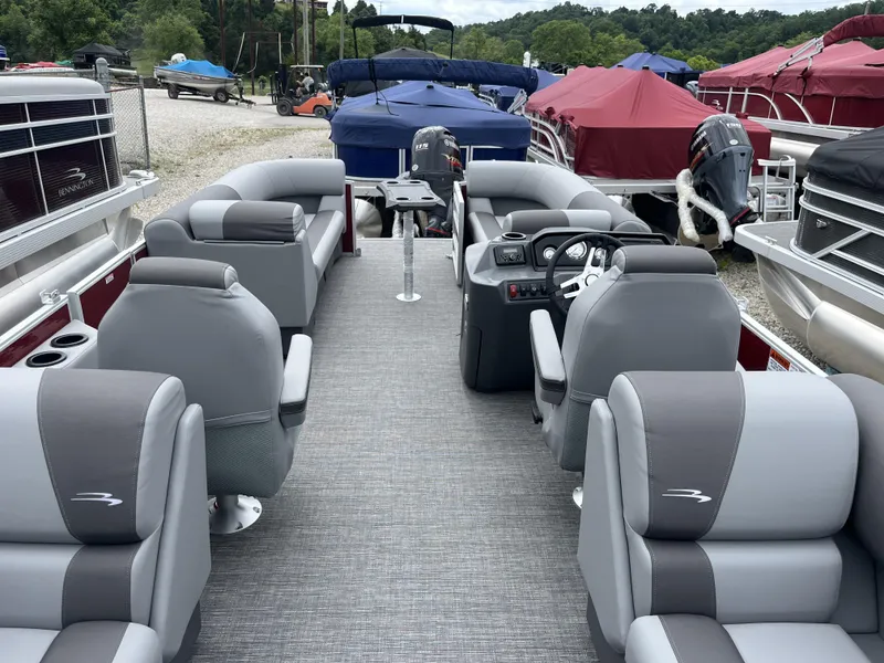 Slide: The Image of 2024 Bennington 22 SVSR pontoon boat with spacious seating and modern interior design. - 3