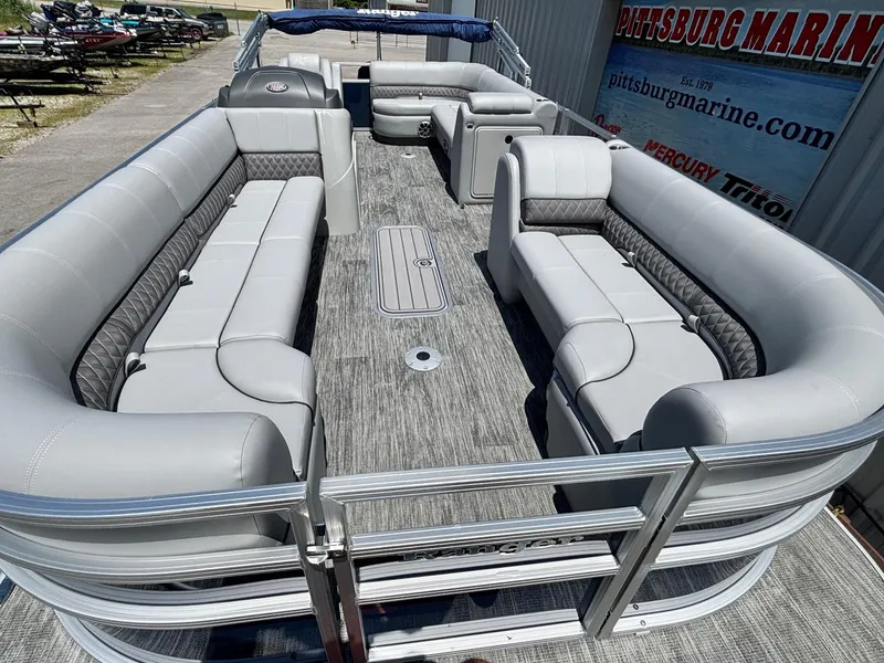 Slide: The Image of 2025 Ranger Reata 223C pontoon boat with spacious seating and modern design. - 2
