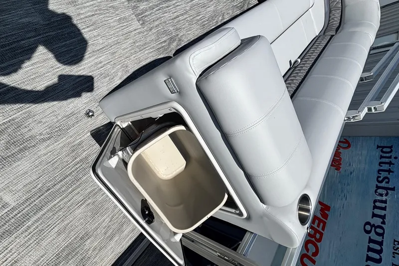 Slide: The Image of 2025 Ranger Reata 223C boat interior with storage compartment and seating. - 4