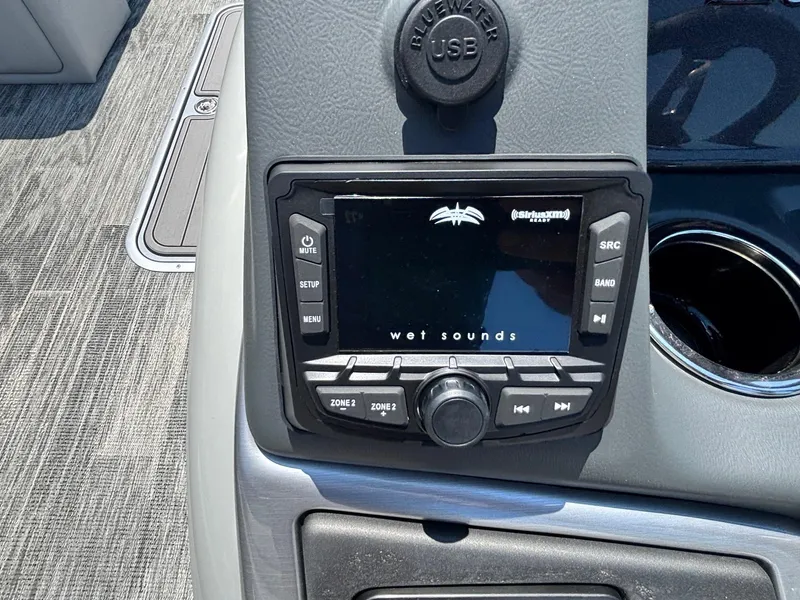 Slide: The Image of 2025 Ranger Reata 223C boat console with Wet Sounds audio system and Bluewater USB port. - 6