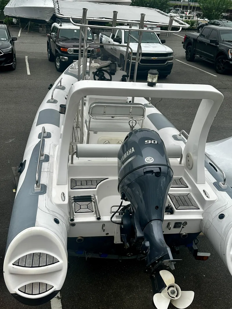 Slide: The Image of 2021 Hedia Rib580 boat with Yamaha 90 engine in parking lot. - 5