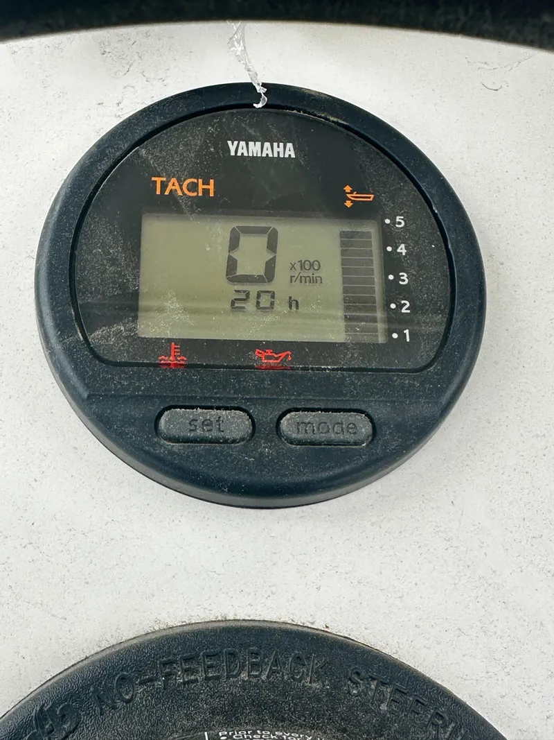 Slide: The Image of Yamaha tachometer display on 2021 Hedia Rib580 boat, showing 0 RPM and 20 hours. - 6