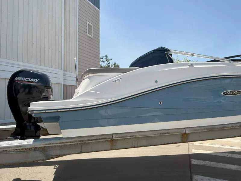 Slide: The Image of 2020 Sea Ray SPX 230 OB boat with Mercury outboard engine, docked outdoors. - 10