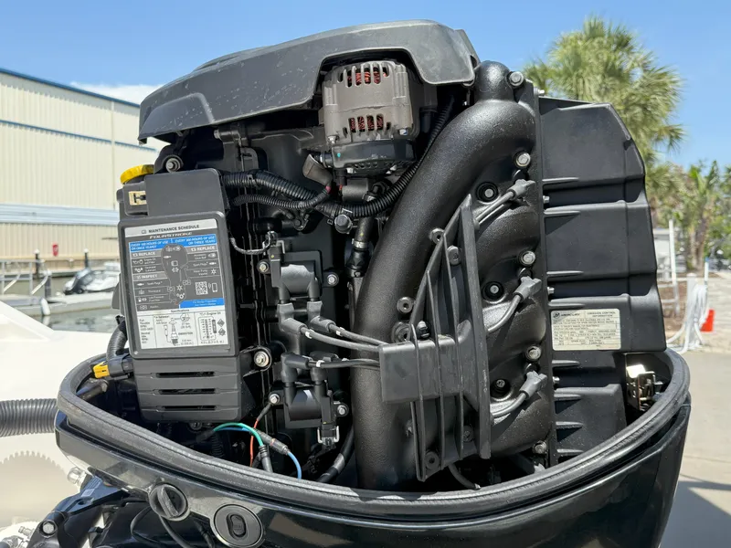 Slide: The Image of 2020 Sea Ray SPX 230 OB outboard engine close-up, showcasing intricate mechanical components. - 17