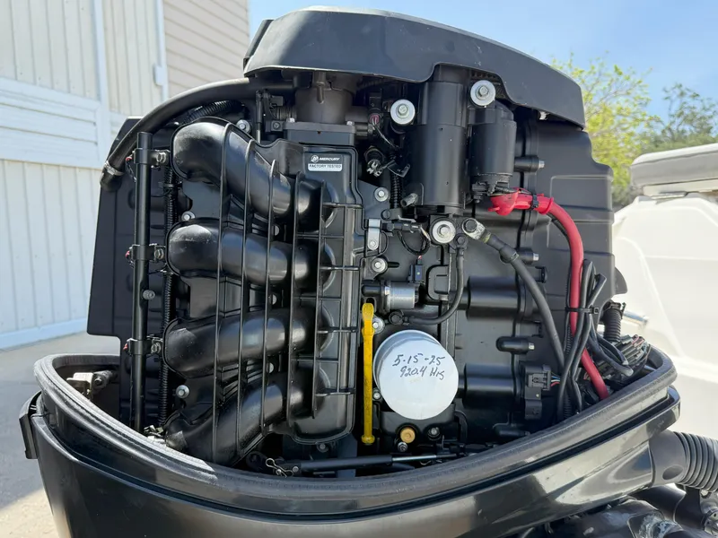 Slide: The Image of Close-up of a 2020 Sea Ray SPX 230 OB outboard engine, showcasing internal components. - 18