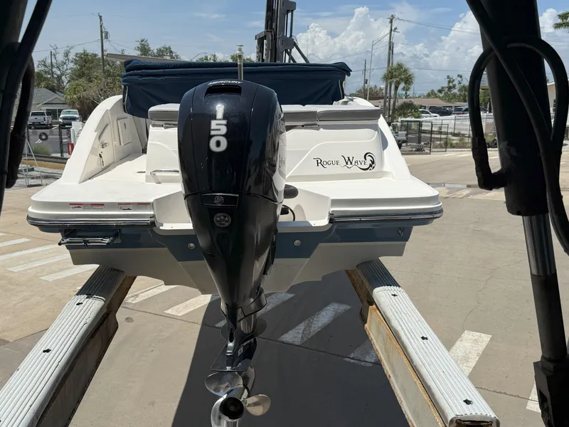 Slide: The Image of 2020 Sea Ray SPX 230 OB boat on trailer, featuring a 150 HP outboard motor. - 21