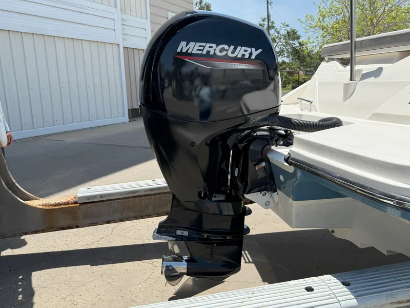 Slide: The Image of 2020 Sea Ray SPX 230 OB with Mercury outboard motor, parked on a trailer. - 24