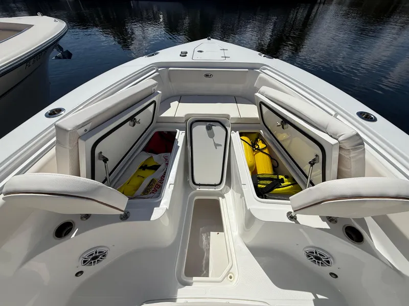 Slide: The Image of 2023 Sea Hunt Gamefish 25 boat interior with open storage compartments. - 28