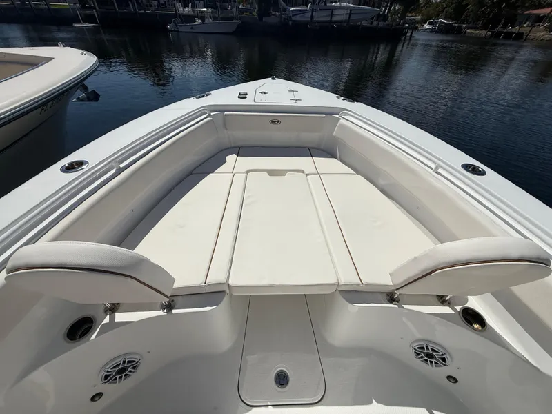 Slide: The Image of 2023 Sea Hunt Gamefish 25 boat with spacious seating and sleek design. - 31