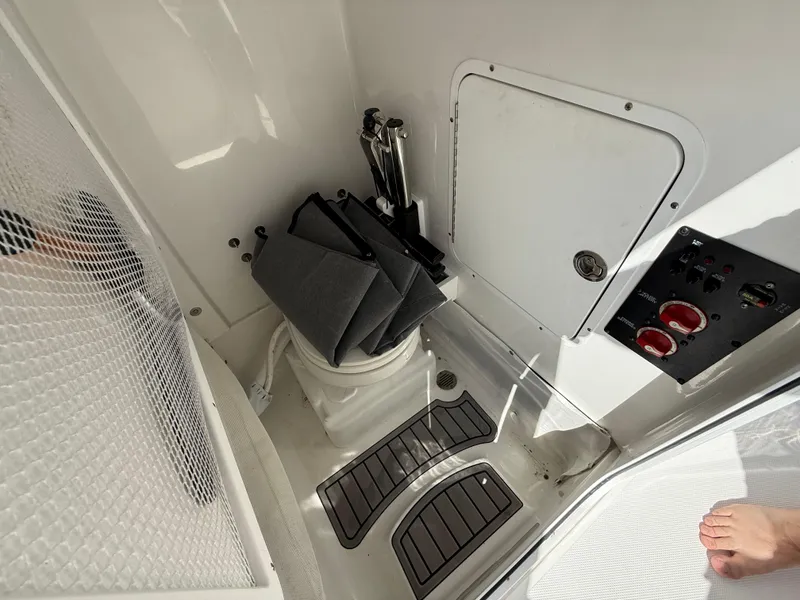 Slide: The Image of 2023 Sea Hunt Gamefish 25 interior with storage and control panel. - 32