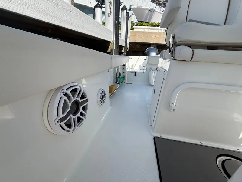 Slide: The Image of 2023 Sea Hunt Gamefish 25 interior with speaker and seating detail. - 34