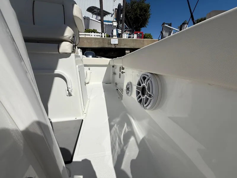 Slide: The Image of 2023 Sea Hunt Gamefish 25 boat interior with seating and speakers. - 35