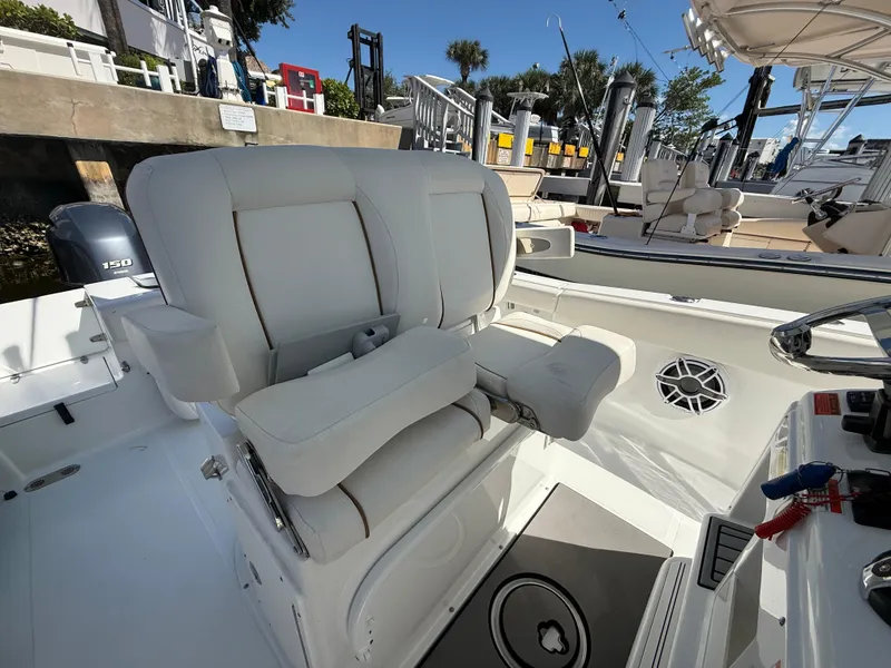Slide: The Image of 2023 Sea Hunt Gamefish 25 boat with plush seating and modern controls. - 36