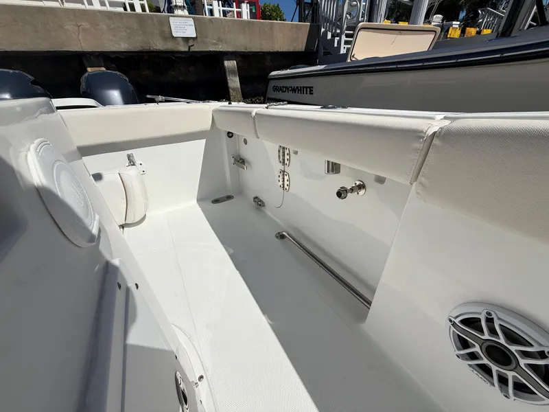 Slide: The Image of 2023 Sea Hunt Gamefish 25 boat interior with seating and speaker. - 38
