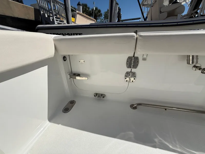Slide: The Image of 2023 Sea Hunt Gamefish 25 boat interior with seating and stainless steel fixtures. - 39