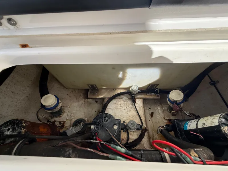 Slide: The Image of 2023 Sea Hunt Gamefish 25 boat engine compartment with wiring and components. - 40