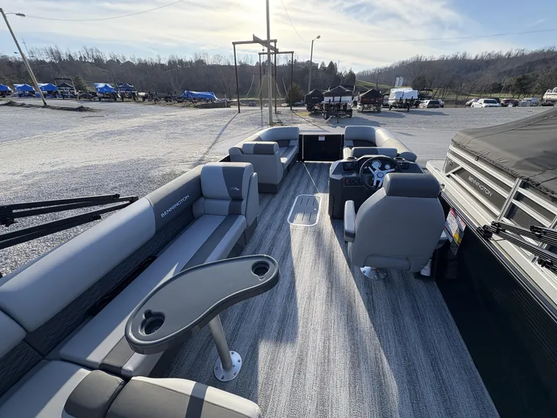 Slide: The Image of 2025 Bennington 21 SLSE pontoon boat interior with seating and steering console. - 3