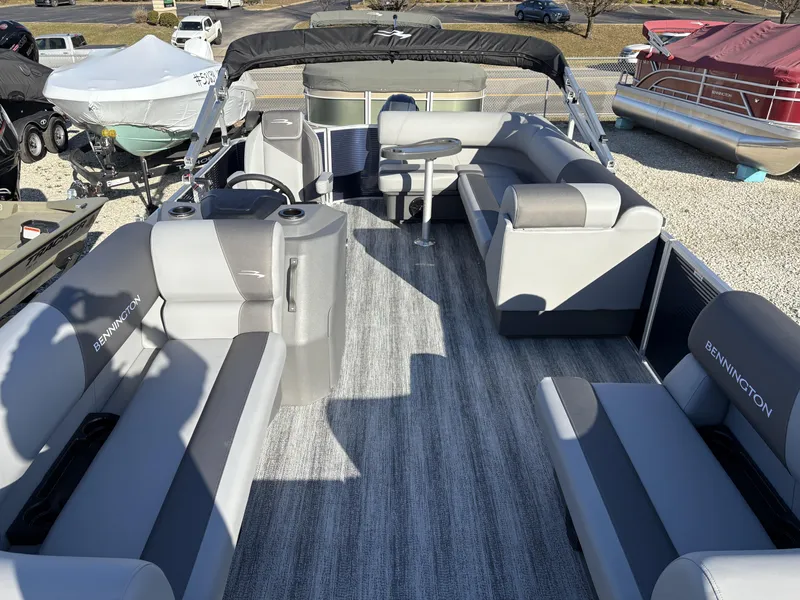Slide: The Image of 2025 Bennington 21 SLBF pontoon boat with spacious seating and modern design. - 2