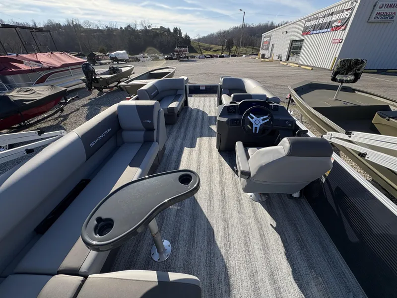 Slide: The Image of 2025 Bennington 21 SLBF pontoon boat interior with seating and steering console. - 3