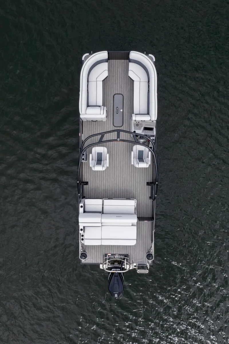 Slide: The Image of 2023 Harris 250 Sunliner Sport pontoon boat on water, aerial view. - 7