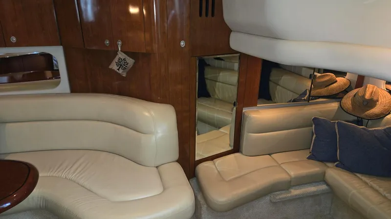 Slide: The Image of Luxurious interior of a 2004 Sea Ray 380 Sundancer yacht with leather seating. - 24