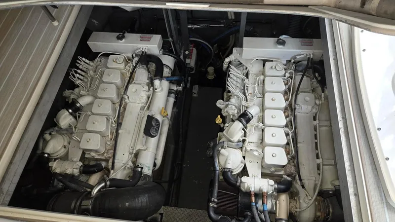 Slide: The Image of Engine compartment of a 2004 Sea Ray 380 Sundancer with dual engines. - 31