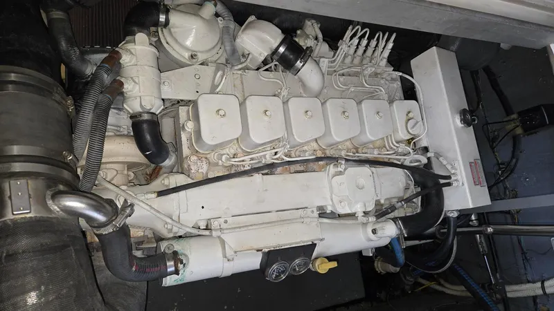 Slide: The Image of Engine compartment of a 2004 Sea Ray 380 Sundancer boat. - 33