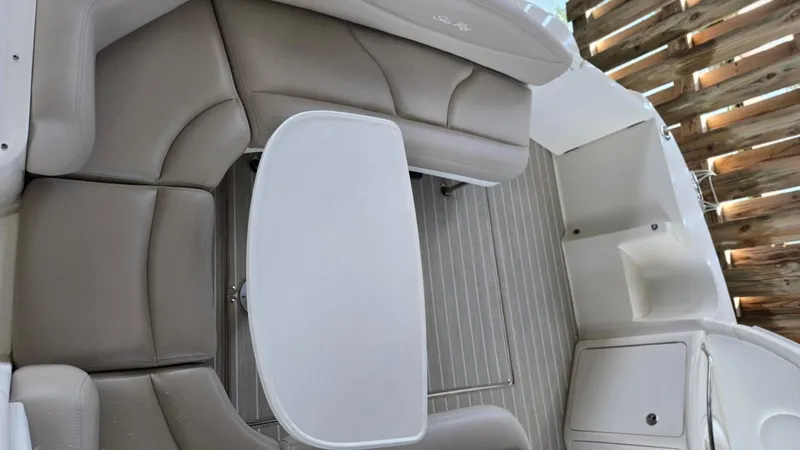 Slide: The Image of 2004 Sea Ray 380 Sundancer interior with beige seating and white table. - 8