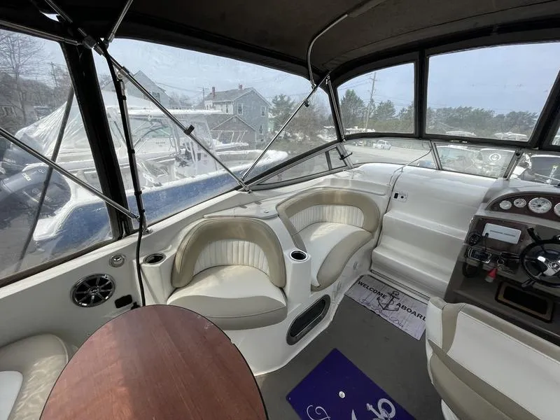 Slide: The Image of Interior of 2014 Stingray 250CS boat with seating and control panel. - 6