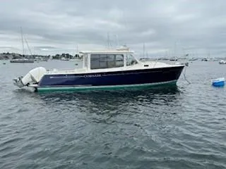 Slide: The Image of 2020 MJM 35z boat on water under cloudy sky. - 3