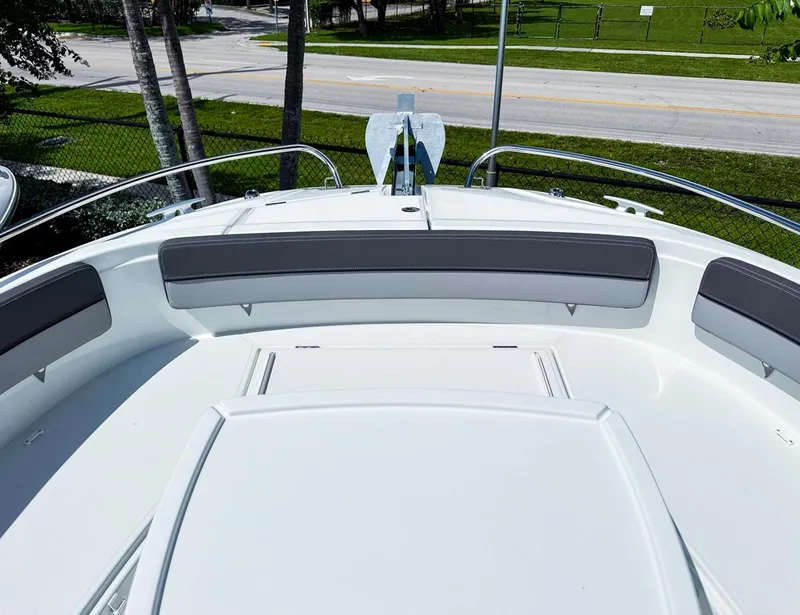Slide: The Image of 2024 Jeanneau LEADER 9.0CC boat deck with seating and railing. - 19