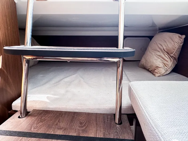 Slide: The Image of 2024 Jeanneau LEADER 9.0CC cabin interior with ladder and cozy bedding. - 22