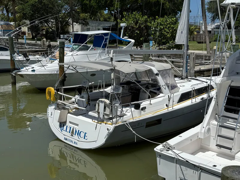 Slide: The Image of 2017 Beneteau Oceanis 41.1 sailboat docked in a marina. - 10