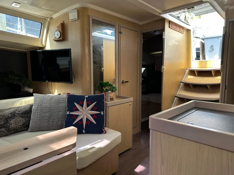 Slide: The Image of Interior of 2017 Beneteau Oceanis 41.1 yacht with modern furnishings and nautical decor. - 17
