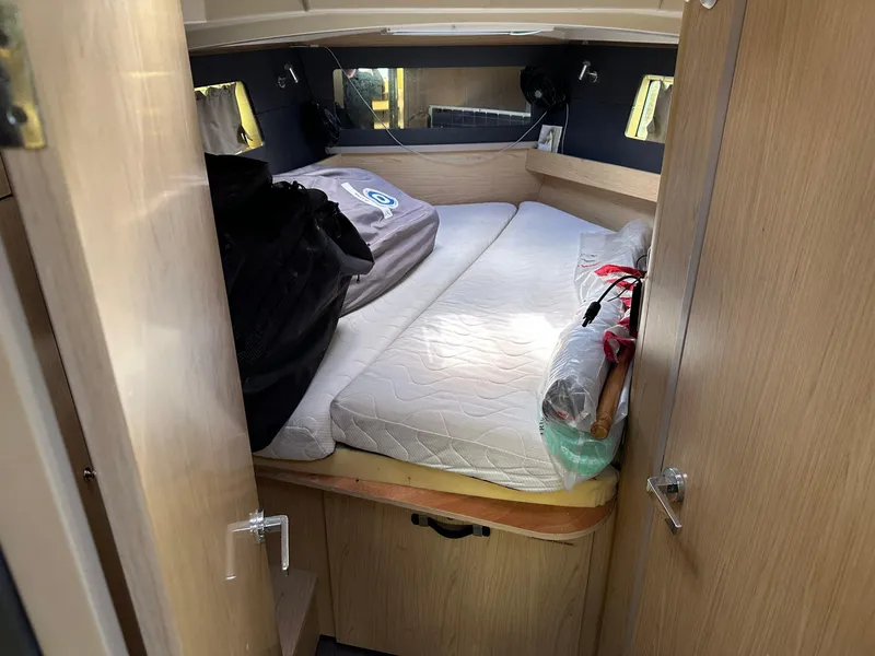 Slide: The Image of Cozy cabin interior of 2017 Beneteau Oceanis 41.1 sailboat with bed and wooden furnishings. - 20