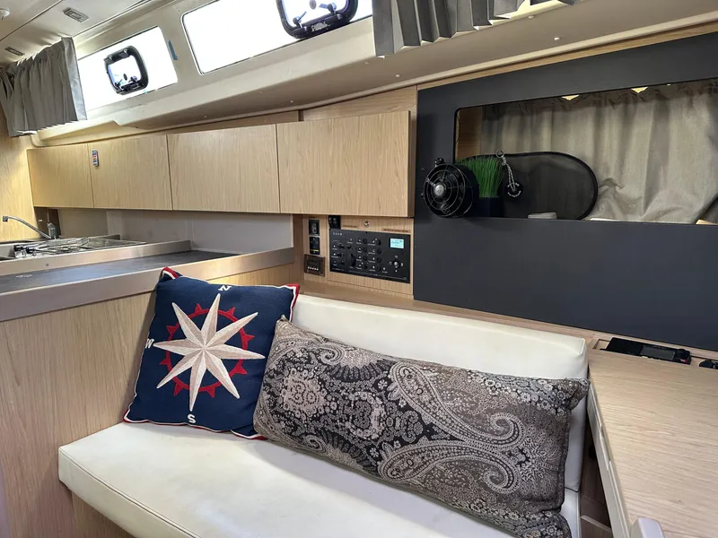 Slide: The Image of Interior of 2017 Beneteau Oceanis 41.1 yacht with modern seating and nautical decor. - 21