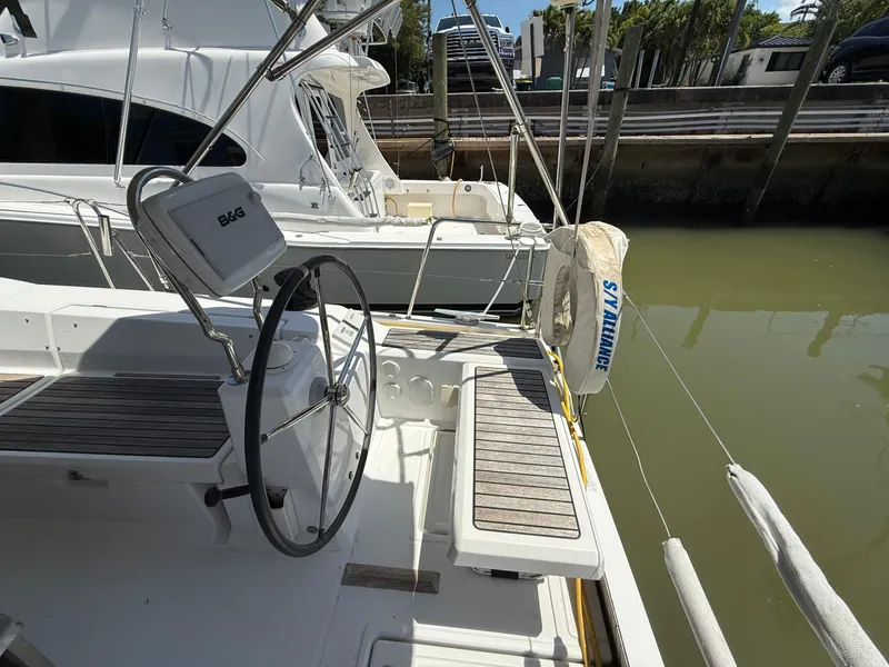 Slide: The Image of 2017 Beneteau Oceanis 41.1 sailboat cockpit with steering wheel and seating. - 23